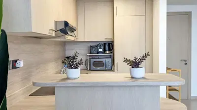 a kitchen with a counter with two potted plants on it at DAYF-SKG High Floor Studio in Sky Gardens Heart of DIFC in Dubai