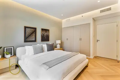 a large white bedroom with a large white bed at Bookable - 2 Bedroom Boulevard Central in Dubai