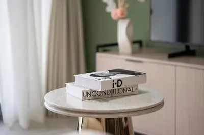two boxes sitting on top of a table at KeyRock Golf Gate - Stylish Retreat with Pool and Gym in Dubai