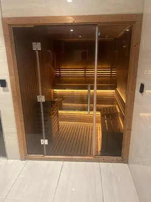 an elevator in a building with a glass door at Nobles tower tiger in Dubai