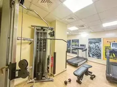 a room with a gym with machines and a treadmill at Luxury 1 BHK in Dubai Marina By dPie Man 1011 in Dubai
