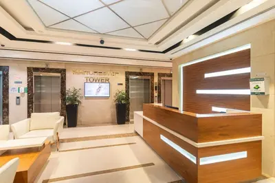 a lobby with a couch and a tv at Luxury 1 BHK in Dubai Marina By dPie Man 1011 in Dubai