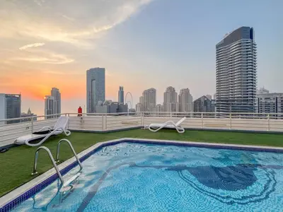 a swimming pool on the roof of a building at Luxury 1 BHK in Dubai Marina By dPie Man 1710 in Dubai