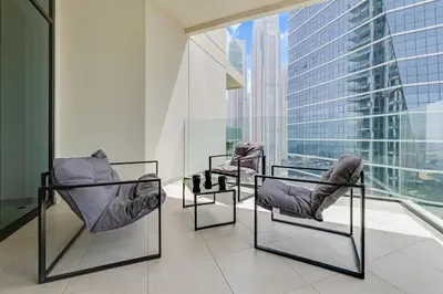 two chairs in a room with a large window at Elegant 1B Missoni-Near Burj & Dubai Mall in Dubai