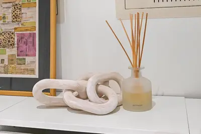 a vase and two snakes on a counter next to a vase at Golden Stays - Luxury Emaar Beachfront 2BR I Sea & Palm Views in Dubai