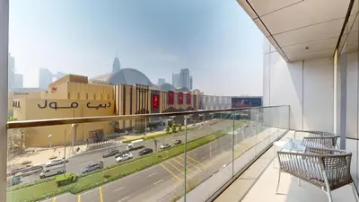 a balcony with a view of a city with traffic at Boulevard Point - One Bed with Burj Khalifa View in Dubai