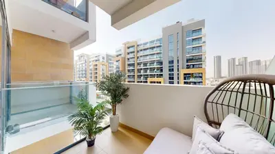 an apartment balcony with a view of the city at Azizi Riviera 18 - Peaceful Studio in Meydan in Dubai