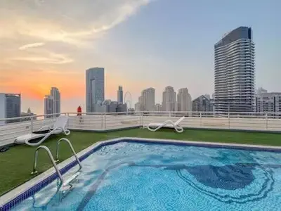 a swimming pool on the roof of a building at Luxury 2BR in Dubai Marina Man 912 in Dubai