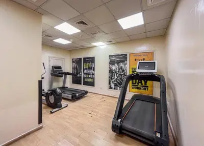 a gym with two exercise bikes and a treadmill at Luxury 3BHK w Floating Bed in Dubai Marina Man 2805 in Dubai