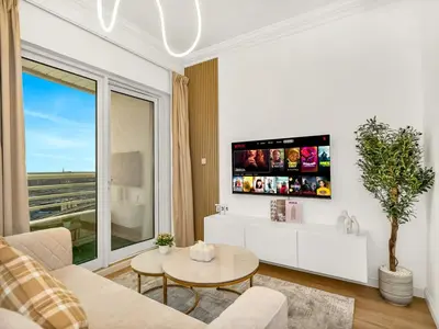 a living room with a couch and a table at Luxury 3BHK w Floating Bed in Dubai Marina Man 2805 in Dubai