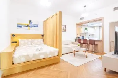 a bedroom with a bed and a tub in it at Luxury 2BHK in Dubai Marina By dPie MP 1514 in Dubai