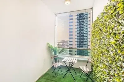 a balcony with three chairs and a window at Luxury 2BHK in Dubai Marina By dPie MP 1514 in Dubai