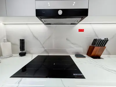 a kitchen with a black and white counter top at A Signature Living Experience Luxury One-Bedroom in Binghatti Emerald, JVC, Dubai in Dubai