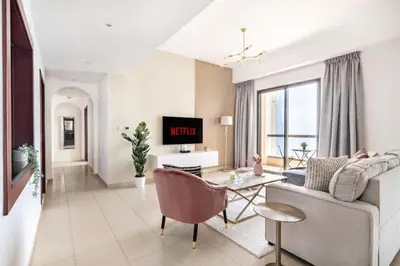 a living room with a couch and a table at MiamiDXB Full Sea View -2Bd apartment in Dubai