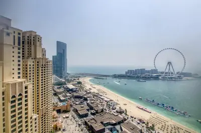 a view of a beach with a ferris wheel in the water at MiamiDXB Full Sea View -2Bd apartment in Dubai