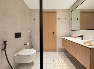 a bathroom with a toilet and a sink at Spacious Studio Private Balcony Sea View in Dubai