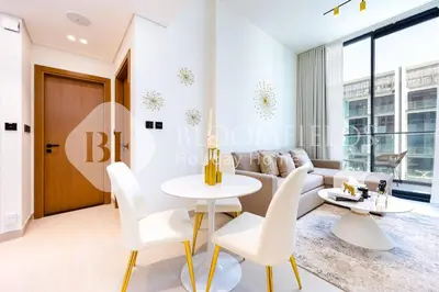 a living room with a couch and a table at Bloomfields Cozy 1Br Binghatti House in Dubai