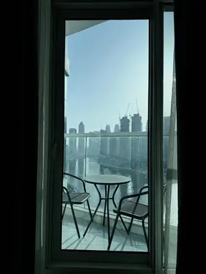 a view of a balcony with a table and chairs at Apartment In Downtown Dubai in Dubai