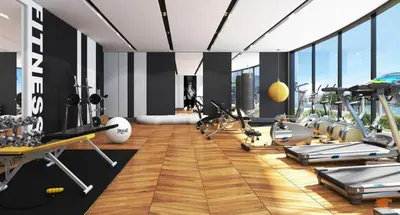 a gym with treadmills and exercise equipment in a room at Luxury 1BR in Nobles Tower Business Bay in Dubai