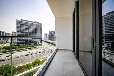 an apartment balcony with a view of a highway at Modern Studio I Smart Home I Business Bay in Dubai