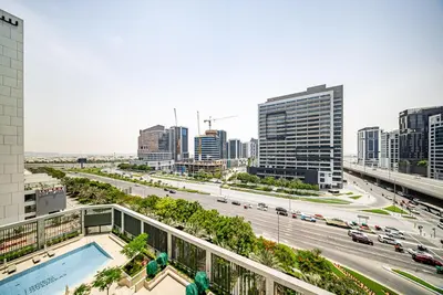 a view of a city with a highway and buildings at Modern Studio I Smart Home I Business Bay in Dubai