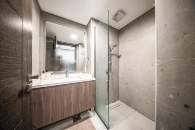 a bathroom with a sink and a shower at Modern Studio I Smart Home I Business Bay in Dubai