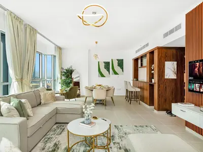 a living room with a couch and a table at Luxury two Bedroom Apartment I Front row Downtown with Private Fountain & Burj View by Luxury Space in Dubai