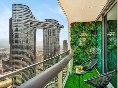 a balcony with a view of a city at Kensington 2BR walk to Dubai Mall via Link in Dubai