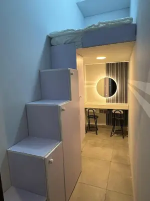 a room with a bunk bed and a desk at Modern Private Hostel Room near Business Bay Downtown in Dubai