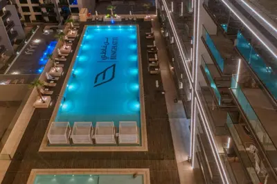 an overhead view of a swimming pool in a building at Large 1BR, Pool View, Near Circle Mall, Parking in Dubai
