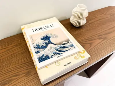 a book sitting on top of a wooden table at High-Rise Apartment by Burj and Fountain in Dubai