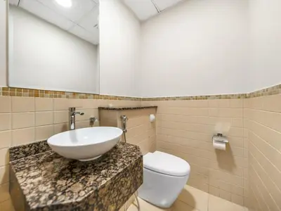 a bathroom with a sink and a toilet at Comfy 2BR Amwaj 4 Sleeps 10 in Dubai