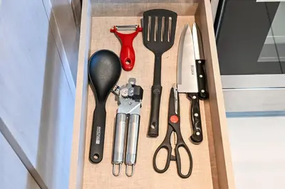a box with kitchen utensils in it at Modern 1BR in ACT Tower 1 in Dubai
