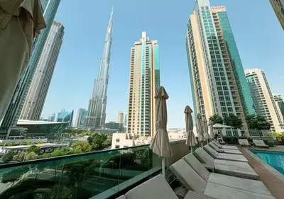 a view of the city from the balcony at 2BR Pool Burj View Dubai Mall in Dubai