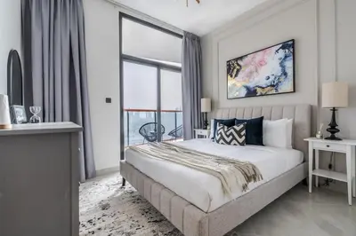 a bedroom with a bed and a large window at Full Dubai Skyline View on High Floor in Dubai