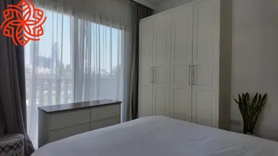 a bedroom with a white bed and a window at Amazing 3 bedrooms in Mayas geneva in Dubai