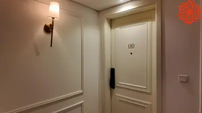 a door in a hallway with a light on it at Amazing 3 bedrooms in Mayas geneva in Dubai