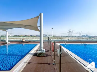 a swimming pool on the roof of a building at Elegant 1BR at Azizi Riviera l Prime Location in Dubai