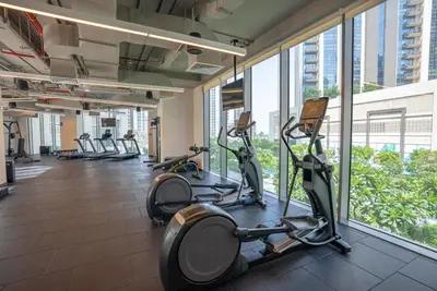 a gym with treadmills and ellipticals in a building at Appealing 1BR at 17 Icon Bay, Dubai Creek Harbour in Dubai
