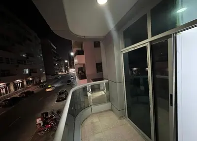 a view of a city street at night from a building at Beautiful Partition Room in Al Barsha 1 in Dubai