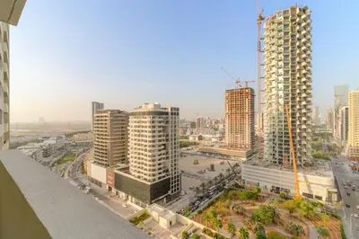 an aerial view of a city with tall buildings at Modern JVC Studio with Pool Gym and Easy Access to Attractions in Dubai
