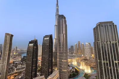 a group of tall buildings in a city at FIRST CLASS 4BR Luxe Downtown Escape in Dubai