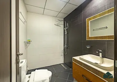 a bathroom with a sink and a toilet at Convertible 1BR with Canal and Skyline View by BMS in Dubai