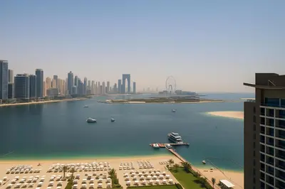 a view of a large body of water with a city at Happy Dom Palm in Dubai