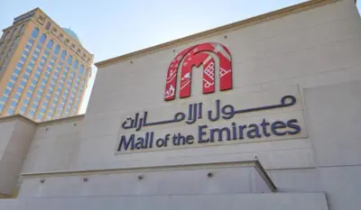a mall of the emirates sign on a building at Elegant Partition Room Al Barsha 1 in Dubai