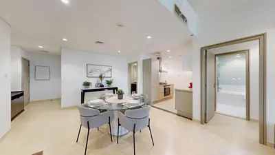 a kitchen and dining room with a glass table and chairs at Marina Heights 1 - Opulent One Bedroom in Marina in Dubai