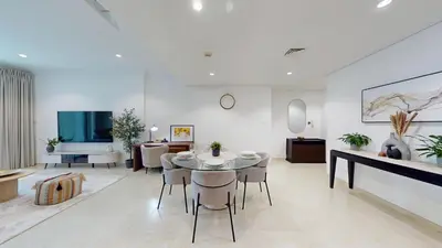 a living room with a table and chairs and a couch at Marina Heights 1 - Opulent One Bedroom in Marina in Dubai