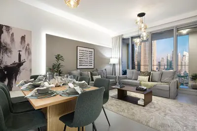 a living room with a dining table and a couch at Stunning 4BR with Burj Khalifa and Fountain View, Downtown Dubai in Dubai