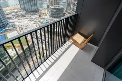 a balcony with a bench and a view of a city at Cloud 18 Studio - Business Bay in Dubai