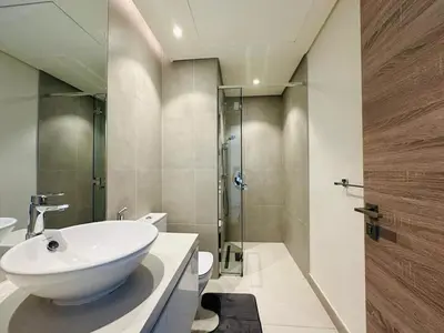 a bathroom with a white sink and a shower at Sophisticated Fully Furnished and Family-Friendly in Dubai